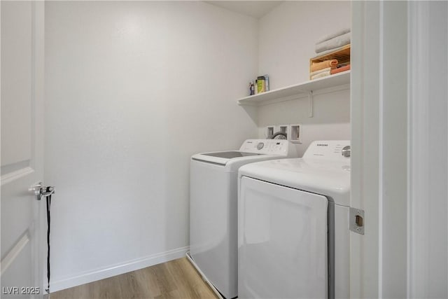 3880 Enchanted Sky St, Las Vegas, NV 89129 - laundry room with washer and dryer and light wood-style floors