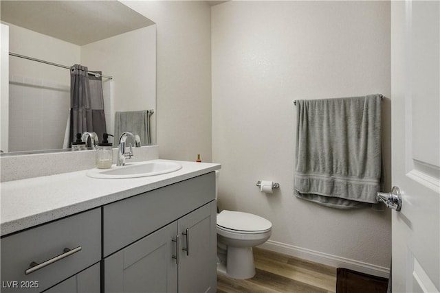 3880 Enchanted Sky St, Las Vegas, NV 89129 - bathroom featuring vanity, wood finished floors, and curtained shower
