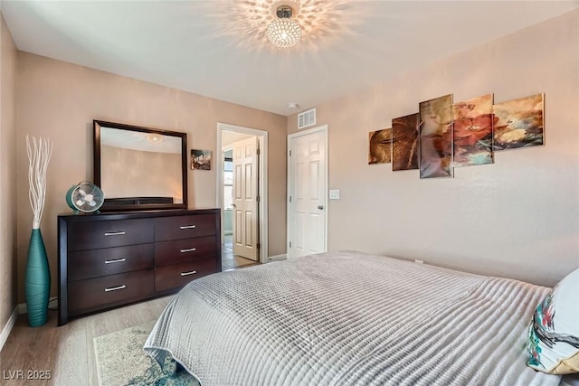 9853 Bangalore Ct, Las Vegas, NV 89148 - bedroom with baseboards and light wood-style floors
