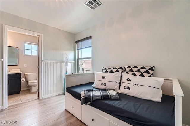 9853 Bangalore Ct, Las Vegas, NV 89148 - bedroom featuring light wood-type flooring and ensuite bath