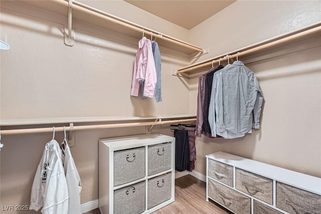 9853 Bangalore Ct, Las Vegas, NV 89148 - spacious closet featuring wood finished floors
