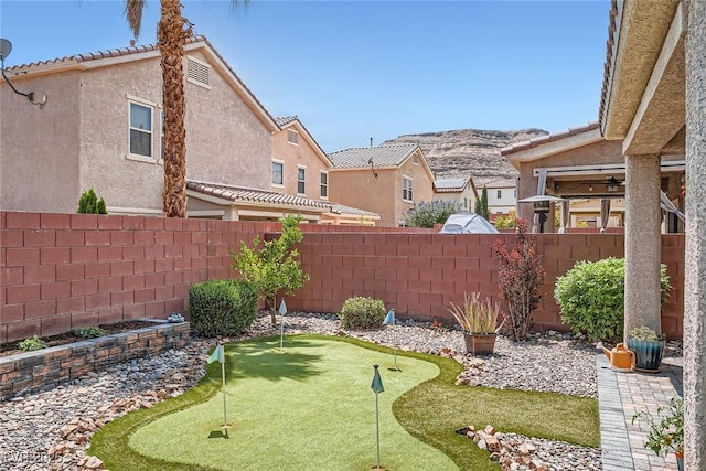 9853 Bangalore Ct, Las Vegas, NV 89148 - view of yard with an area to practice putting and a mountain view