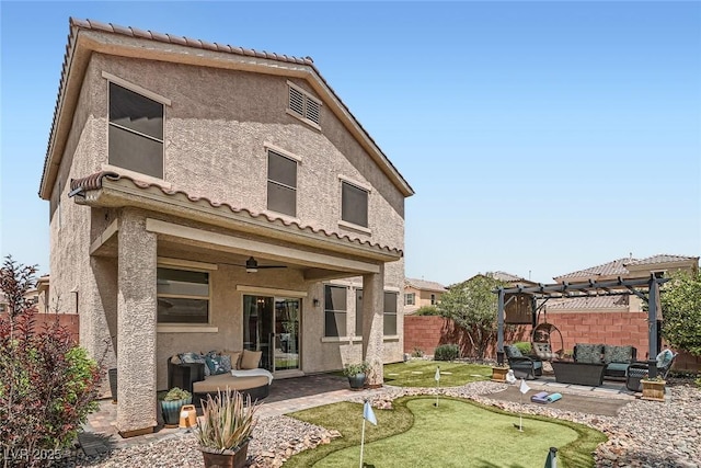9853 Bangalore Ct, Las Vegas, NV 89148 - back of house featuring outdoor lounge area, an area to practice putting, a pergola, a patio, and a fenced backyard
