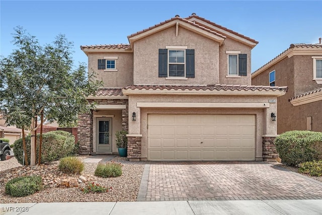 9853 Bangalore Ct, Las Vegas, NV 89148 - view of front of home featuring stone siding, decorative driveway, a tile roof, and stucco siding