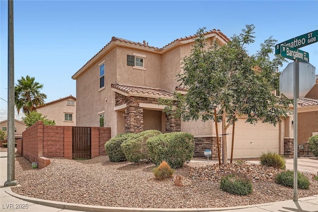9853 Bangalore Ct, Las Vegas, NV 89148 - view of front of house with a tiled roof, stucco siding, and driveway