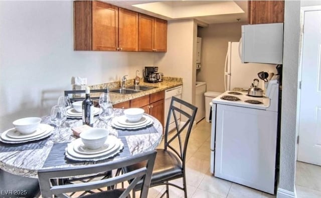 4200 S Valley View Blvd Unit 2081, Las Vegas, NV 89103 - kitchen featuring white appliances, a sink, brown cabinets, and light tile patterned floors