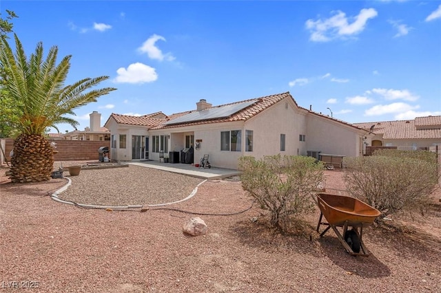 4628 Standing Bluff Way, Las Vegas, NV 89130 - back of house with a patio, solar panels, stucco siding, and a tile roof