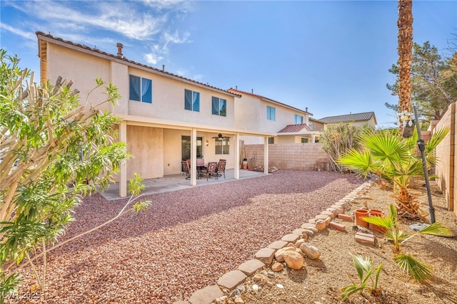 7886 Palace Monaco Ave, Las Vegas, NV 89117 - rear view of house with stucco siding, a patio area, and a fenced backyard