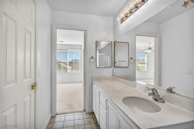 7886 Palace Monaco Ave, Las Vegas, NV 89117 - bathroom featuring vanity, healthy amount of natural light, tile patterned floors, and baseboards