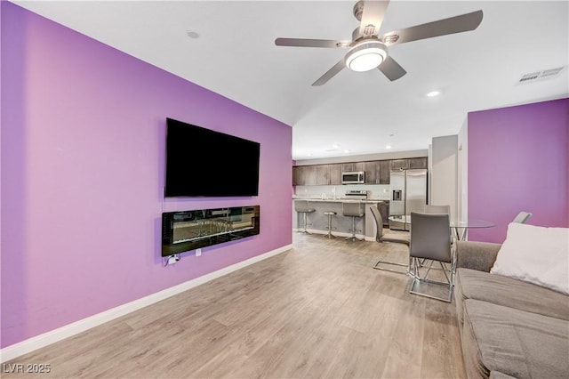 6940 Crescent Gold St, North Las Vegas, NV 89086 - living area featuring a ceiling fan, light wood-type flooring, recessed lighting, and baseboards