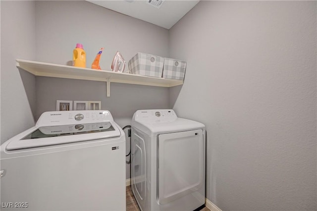 6940 Crescent Gold St, North Las Vegas, NV 89086 - laundry area with independent washer and dryer, baseboards, and wood finished floors