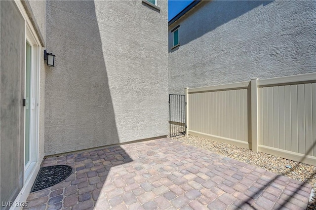 6940 Crescent Gold St, North Las Vegas, NV 89086 - view of patio / terrace featuring a gate