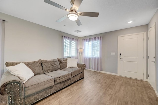 6940 Crescent Gold St, North Las Vegas, NV 89086 - living room featuring light wood finished floors, baseboards, ceiling fan, and recessed lighting