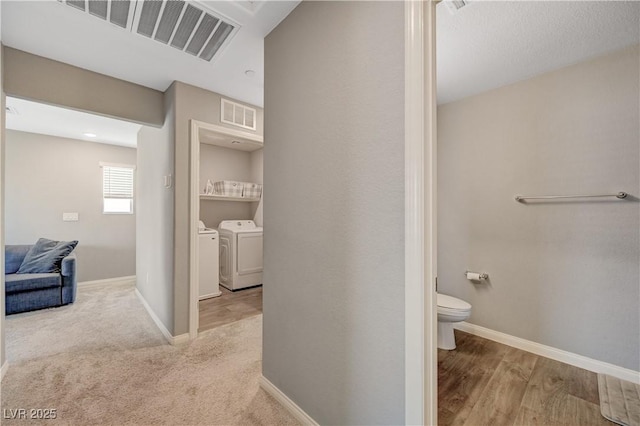 6940 Crescent Gold St, North Las Vegas, NV 89086 - hallway with washing machine and dryer and baseboards