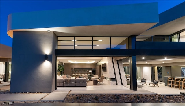 4 Horseshoe Rock Ct, Henderson, NV 89012 - rear view of property with an outdoor hangout area, a patio, and stucco siding