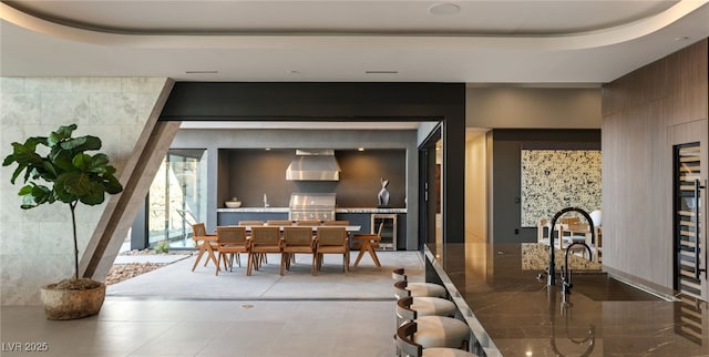 4 Horseshoe Rock Ct, Henderson, NV 89012 - dining space with wine cooler and a tray ceiling