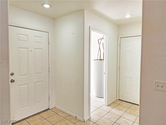 1951 Teepee Rd, Pahrump, NV 89048 - entrance foyer with light tile patterned flooring, gas water heater, baseboards, and recessed lighting