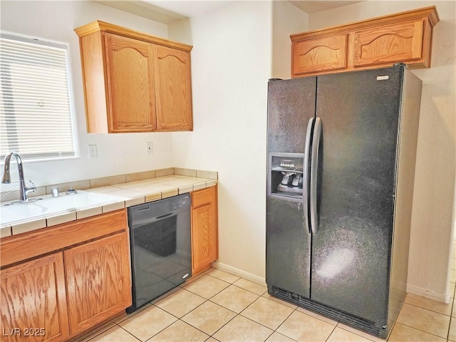 1951 Teepee Rd, Pahrump, NV 89048 - kitchen with black appliances, a sink, light tile patterned floors, and baseboards