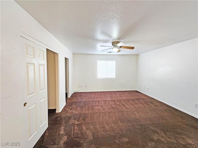 1951 Teepee Rd, Pahrump, NV 89048 - unfurnished bedroom featuring carpet, baseboards, a textured ceiling, and ceiling fan