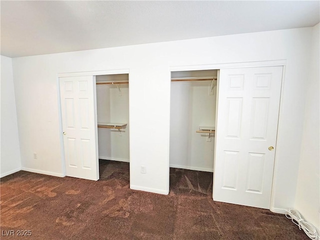 1951 Teepee Rd, Pahrump, NV 89048 - unfurnished bedroom featuring carpet, two closets, and baseboards