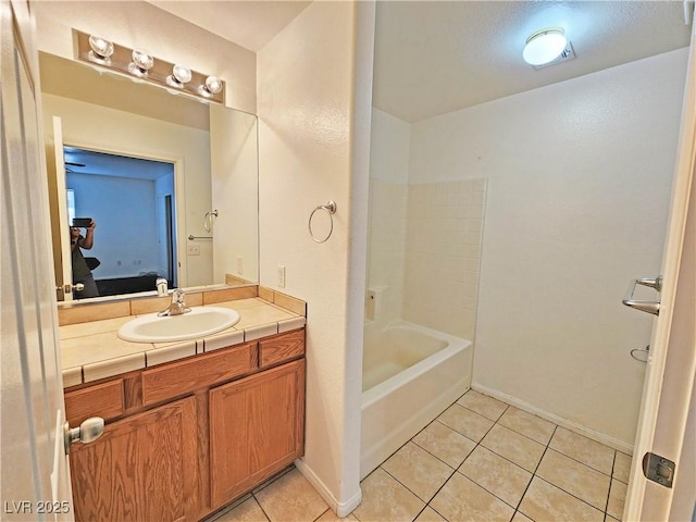 1951 Teepee Rd, Pahrump, NV 89048 - ensuite bathroom featuring vanity, tile patterned flooring, shower / tub combination, and baseboards