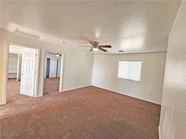 1951 Teepee Rd, Pahrump, NV 89048 - carpeted empty room with a textured ceiling, a ceiling fan, and baseboards