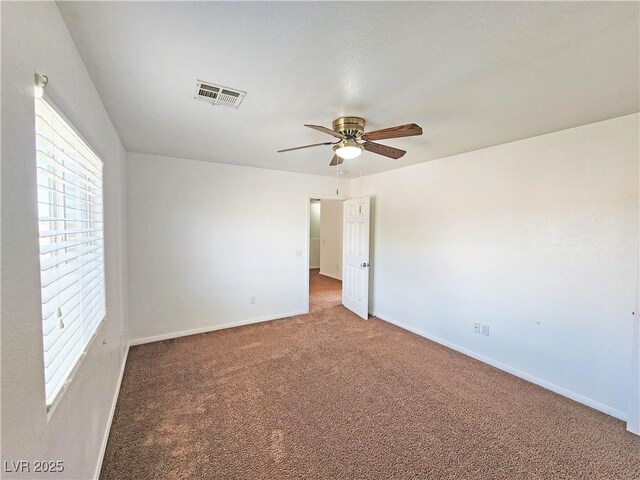 1951 Teepee Rd, Pahrump, NV 89048 - carpeted spare room with healthy amount of natural light, ceiling fan, and baseboards