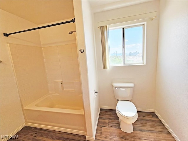 1951 Teepee Rd, Pahrump, NV 89048 - bathroom featuring wood finished floors, toilet, baseboards, and shower / washtub combination