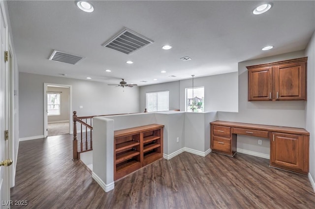 9005 Semillon St, Las Vegas, NV 89148 - kitchen with a peninsula, baseboards, dark wood-type flooring, and recessed lighting
