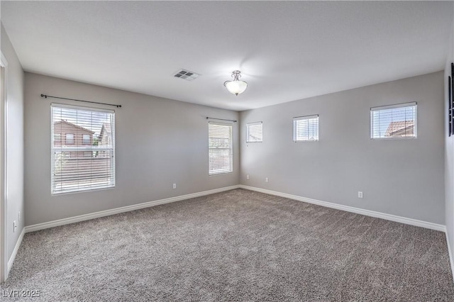 9005 Semillon St, Las Vegas, NV 89148 - carpeted empty room featuring baseboards and healthy amount of natural light