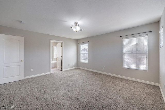 9005 Semillon St, Las Vegas, NV 89148 - unfurnished bedroom with baseboards, light carpet, and ensuite bath