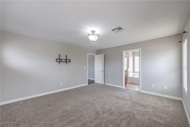 9005 Semillon St, Las Vegas, NV 89148 - unfurnished bedroom featuring carpet floors, baseboards, and connected bathroom