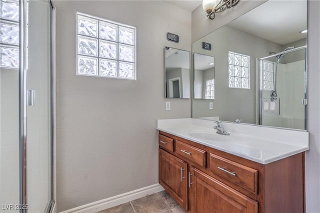 9005 Semillon St, Las Vegas, NV 89148 - bathroom featuring healthy amount of natural light, vanity, a shower with shower door, and baseboards