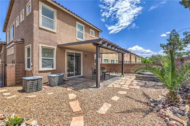 9005 Semillon St, Las Vegas, NV 89148 - rear view of property featuring central AC, stucco siding, a fenced backyard, and a patio