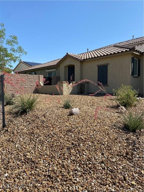 3484 Bradano Ln, Henderson, NV 89044 - back of house featuring stucco siding and a tiled roof