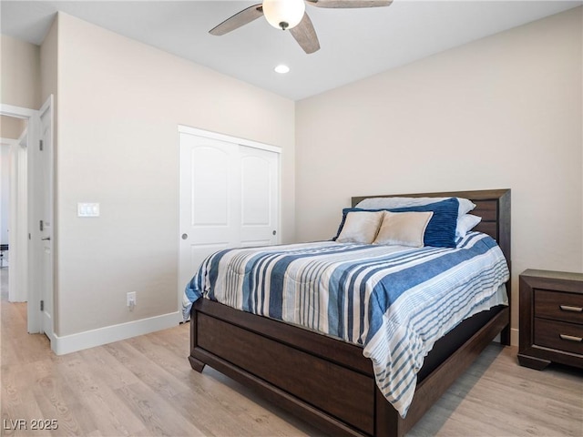 1500 E Laguna St, Pahrump, NV 89048 - bedroom featuring light wood-type flooring, baseboards, recessed lighting, ceiling fan, and a closet