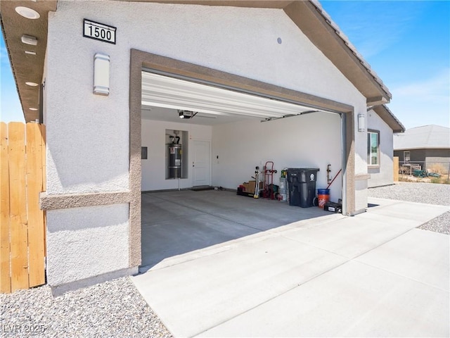 1500 E Laguna St, Pahrump, NV 89048 - garage with a garage door opener, a central vacuum unit, and concrete driveway