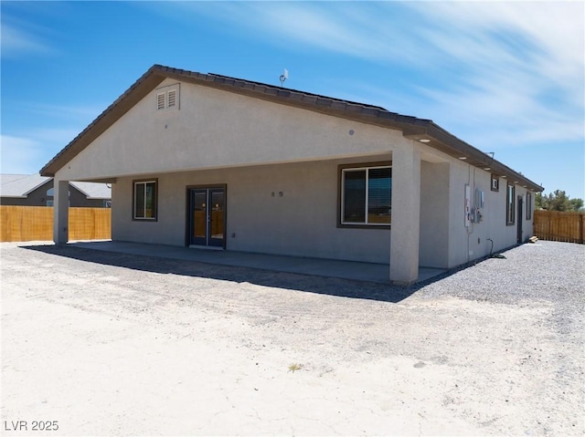 1500 E Laguna St, Pahrump, NV 89048 - back of property with stucco siding and a patio area
