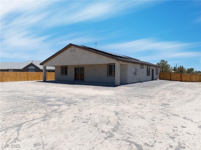 1500 E Laguna St, Pahrump, NV 89048 - back of house featuring stucco siding