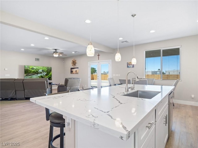 1500 E Laguna St, Pahrump, NV 89048 - kitchen featuring a sink, plenty of natural light, light wood-style floors, recessed lighting, and white cabinetry