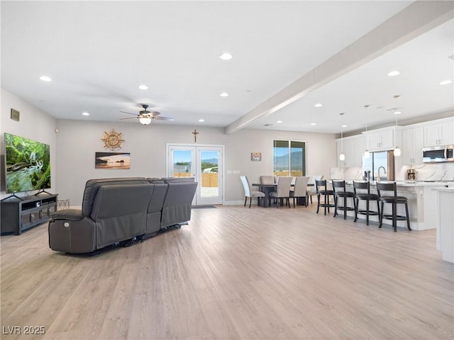 1500 E Laguna St, Pahrump, NV 89048 - living area featuring light wood-style floors, recessed lighting, a ceiling fan, and baseboards