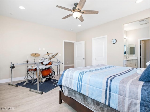 1500 E Laguna St, Pahrump, NV 89048 - bedroom featuring light wood finished floors, recessed lighting, baseboards, ceiling fan, and ensuite bath