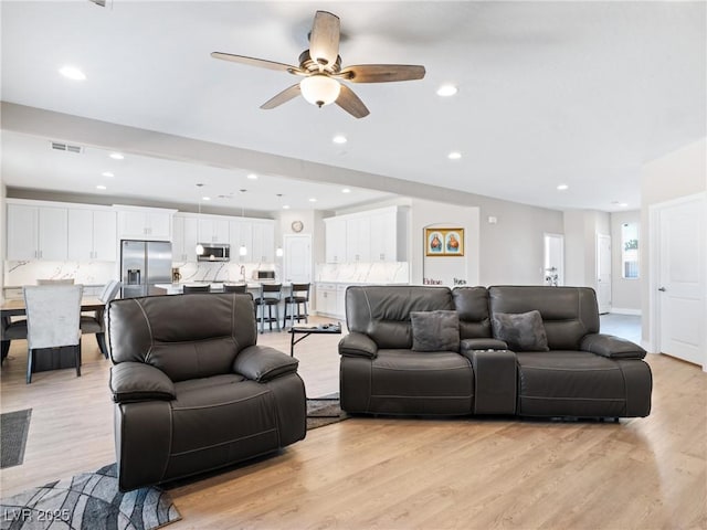 1500 E Laguna St, Pahrump, NV 89048 - living room with light wood-style floors, a ceiling fan, and recessed lighting