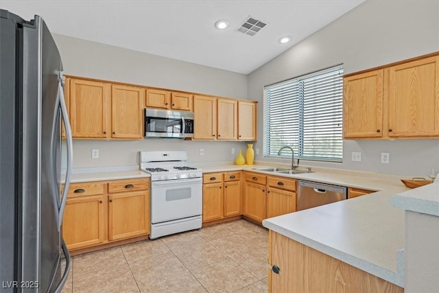 11022 Saint Rafael St, Las Vegas, NV 89141 - kitchen with stainless steel appliances, a sink, light brown cabinetry, light countertops, and recessed lighting