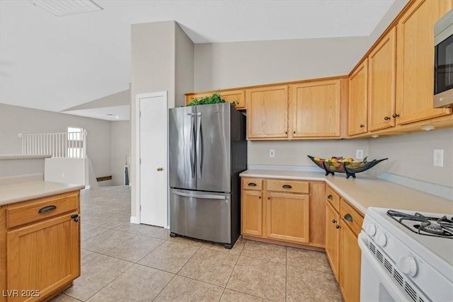 11022 Saint Rafael St, Las Vegas, NV 89141 - kitchen with appliances with stainless steel finishes, light tile patterned floors, light countertops, and light brown cabinets
