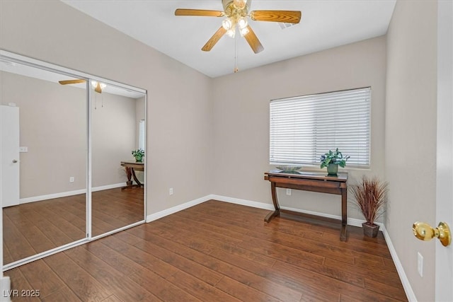 11022 Saint Rafael St, Las Vegas, NV 89141 - unfurnished bedroom featuring hardwood / wood-style floors, a ceiling fan, and baseboards