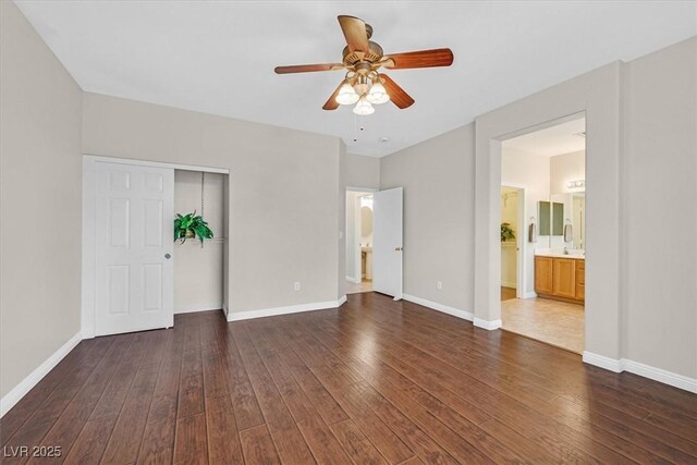 11022 Saint Rafael St, Las Vegas, NV 89141 - unfurnished bedroom with wood-type flooring, a closet, and baseboards