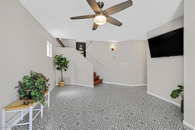 11022 Saint Rafael St, Las Vegas, NV 89141 - below grade area featuring ceiling fan, stairs, and baseboards