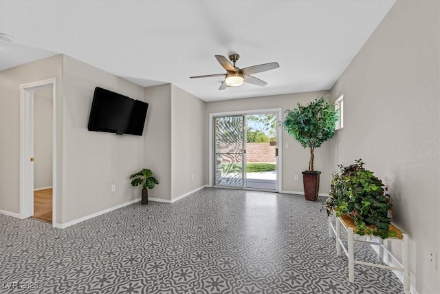 11022 Saint Rafael St, Las Vegas, NV 89141 - unfurnished living room with baseboards and ceiling fan