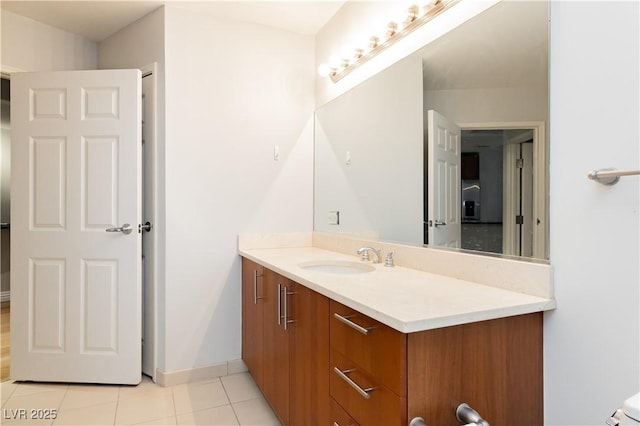 200 W Sahara Ave Unit 910, Las Vegas, NV 89102 - bathroom with vanity, tile patterned flooring, baseboards, and toilet